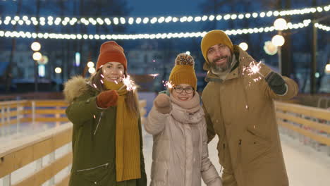 family celebrating at an ice rink