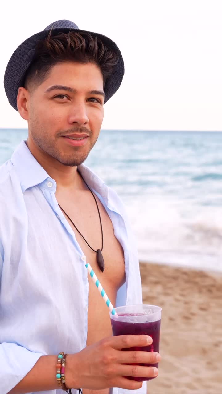 Man enjoying a drink on the beach