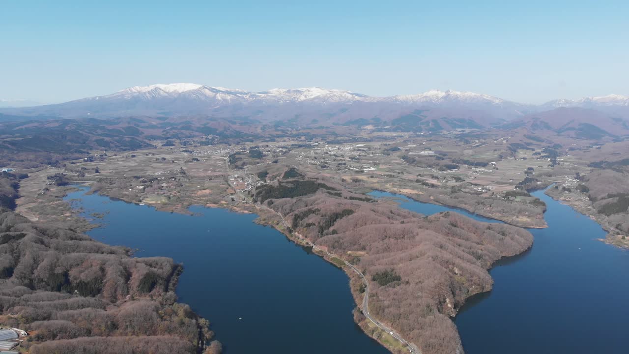 Aerial establishing fly Mount Zao crater lake Landscape in Japan, skyline background