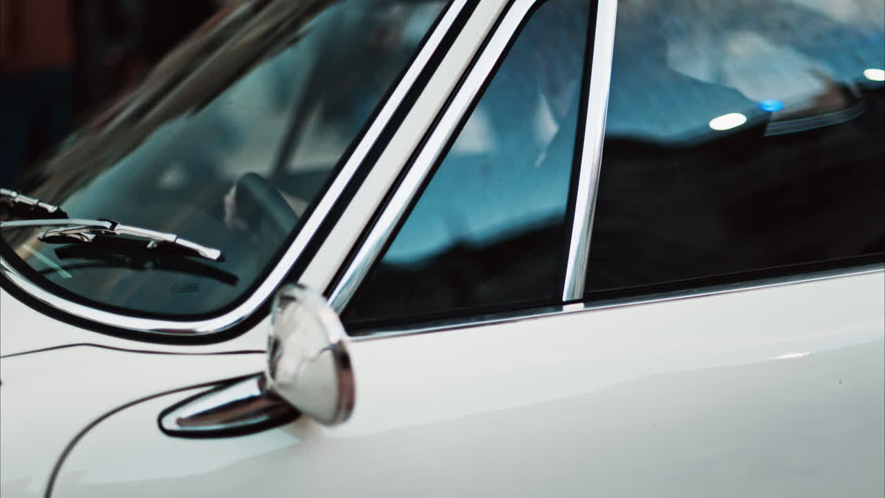 Close up of a white vintage car on the street in Cannes, France