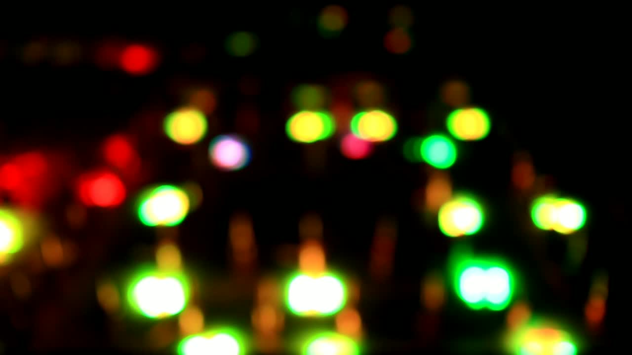 Bokeh video, the effect of lights in the water, with a black background