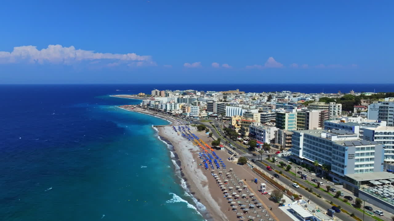 Aerial view sideways in front of downtown Rhodes city, summer day in Greece