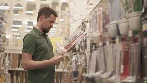 man shopping for home goods at a hardware store