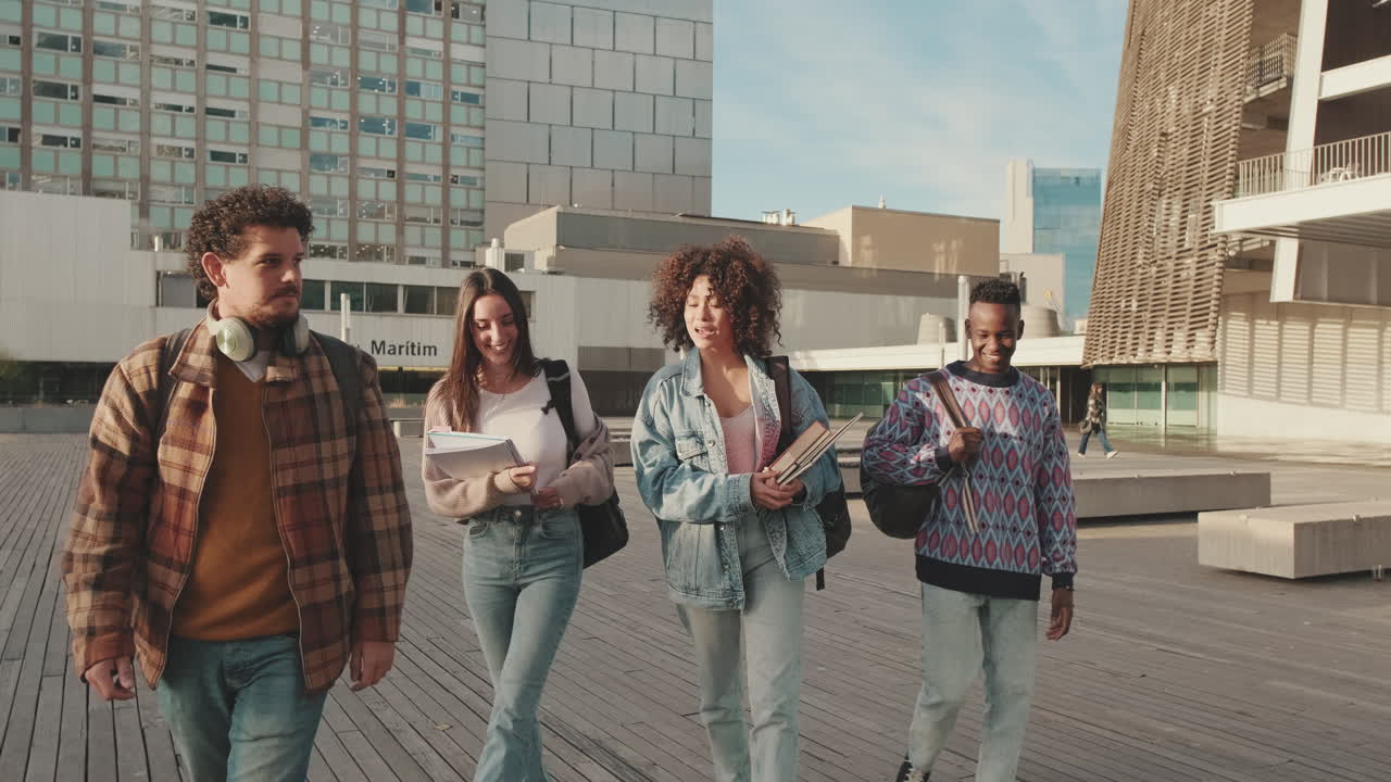 Group of students walking and talking on campus