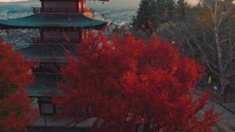 breathtaking footage of the iconic chureito pagoda in fujiyoshida, japan, with stunning sunset views of mount fuji in the background, capturing the beauty of autumn's peak season,