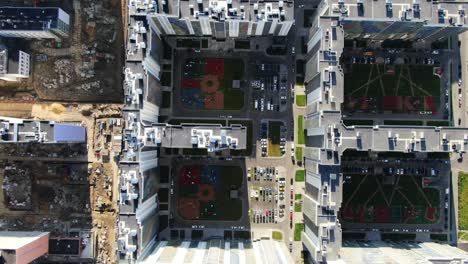 aerial view of modern apartment complex with construction site