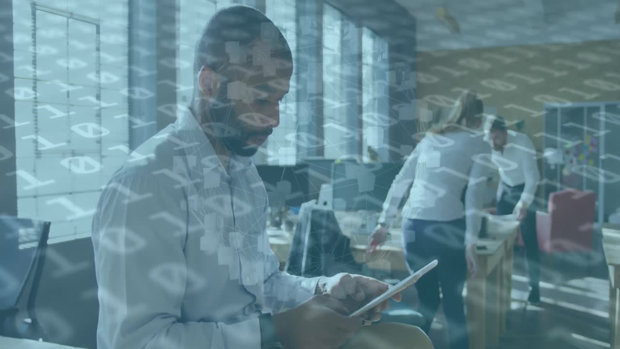 Animation of data processing over african american businessman using tablet at office