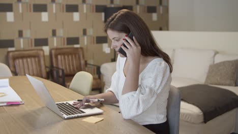 Focused-female-professional-talking-on-cell