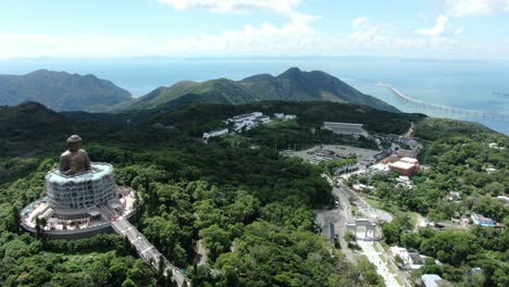 Hong-Kong-Nong-Ping-big-Buddha-and-surrounding-lush-green-environment,-Aerial-view