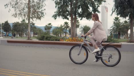 woman cycling in a city park