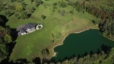 wealthy home oasis surrounded by forest rear view