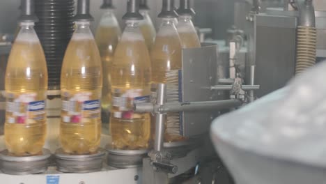 automatic filling machine pours water into plastic pet bottles at modern beverage plant