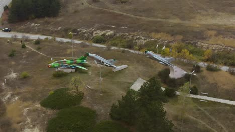 Aerial-panning-footage-of-military-airplanes-outdoor-museum-exhibition-3