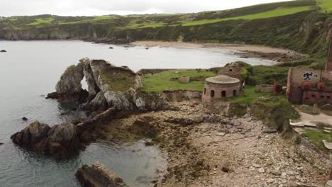 porth wen aerial rising back view abandoned victorian industrial brickwork factory remains on anglesey eroded coastline