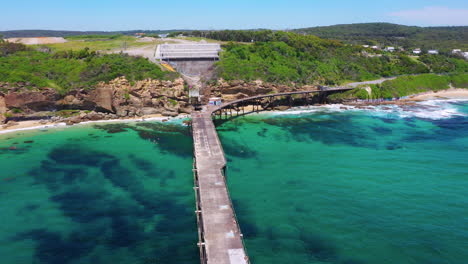 Catherine-Hill-Bay-pier-jetty-on-Australian-coast,-aerial-view