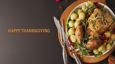 animation of happy thanksgiving text and dinner on table background