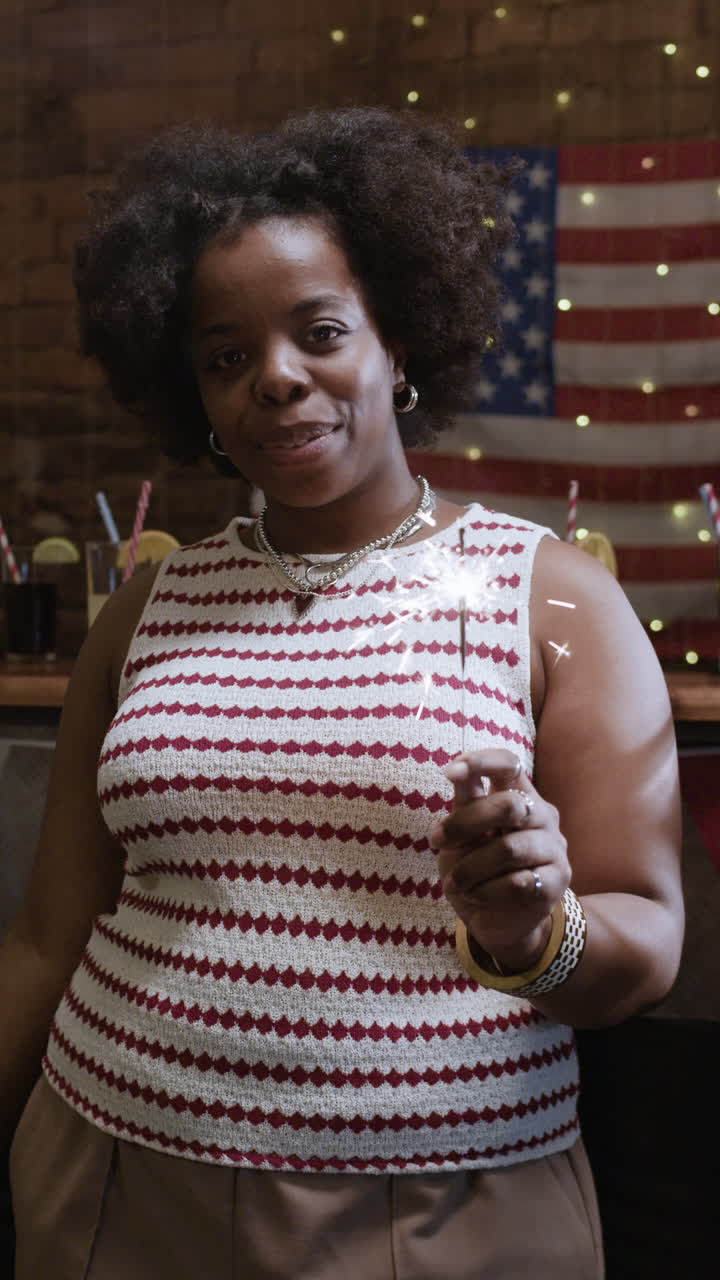Happy Woman Celebrating with Sparkler on Independence Day