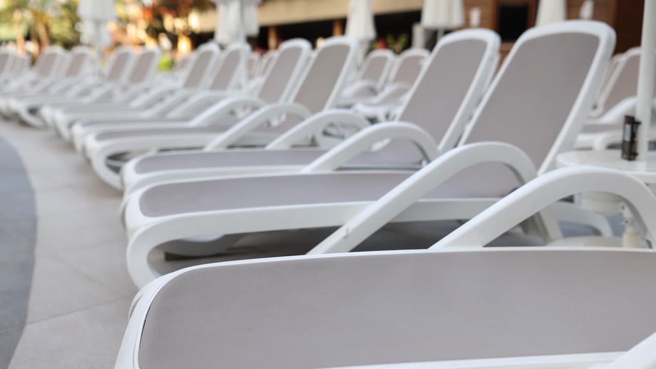 Row of Lounge Chairs by the Pool