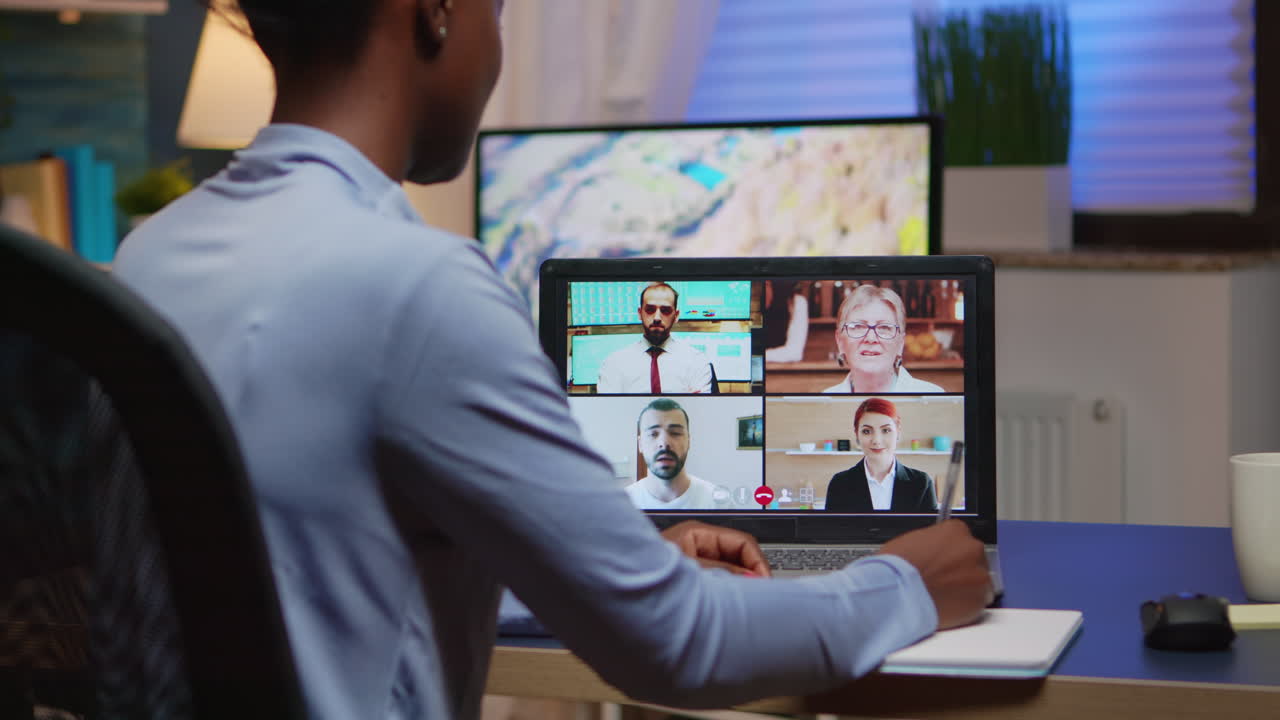 African freelancer working remotely discussing with partners