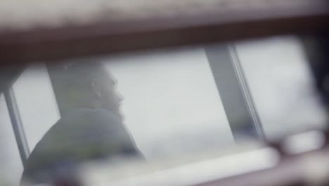 reflection of a person in a ship's control room