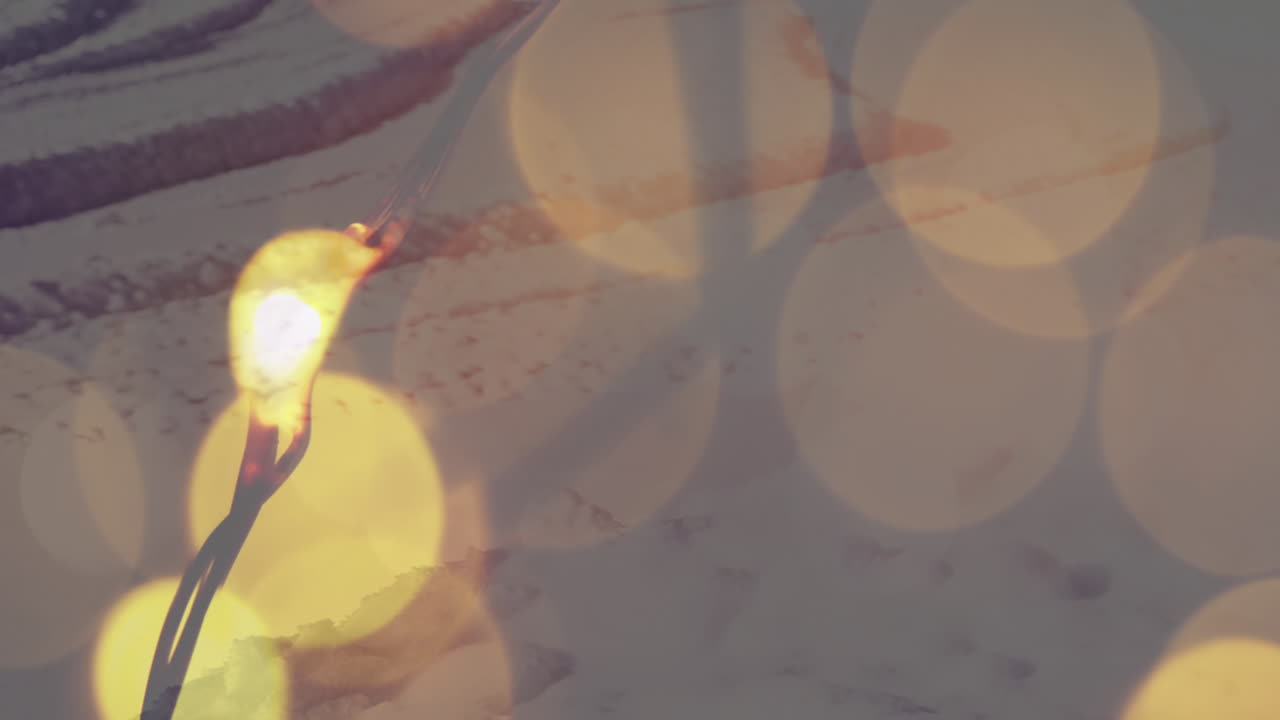 백그라운드에 겨울 풍경과 함께 노란색 빛 반점의 애니메이션