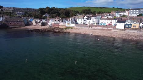 People-Swimming-at-Kingsand-in-Torpoint,-Cornwall-During-Summer's-Day