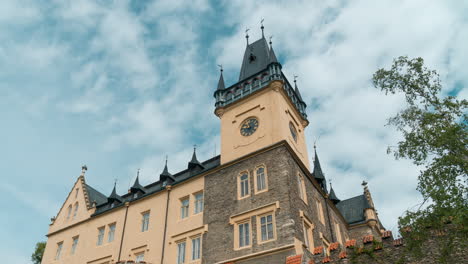 renaissance palace with puffy clouds rushing over turquoise sky, low angle time lapse