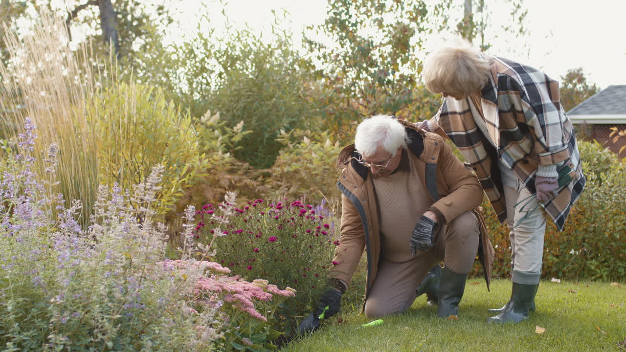 Elderly Couple Gardening Together