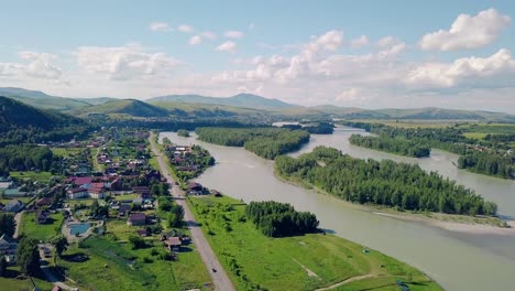 aerial shot top view of the tourist city mountains pine and deciduous forest mountain river 4