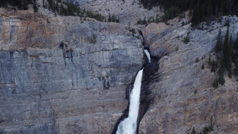 Waterfall-in-the-mountains-approached-tilt-ascending