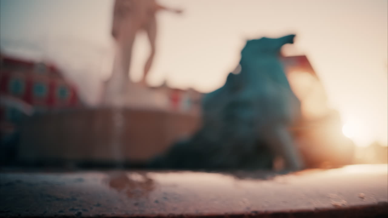 Nice, France - October 8, 2024: Blurry view of the Fontaine du Soleil in Place Massena at sunset
