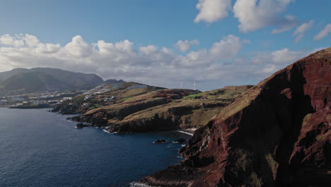 coastal volcanic landscape with wind turbines