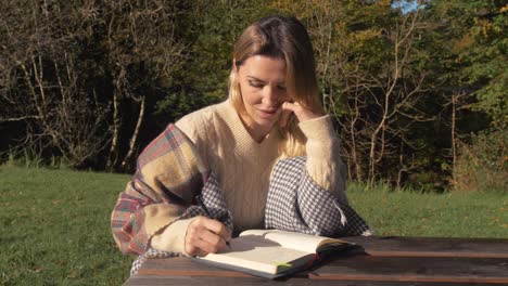 a ukrainian woman studying outdoors