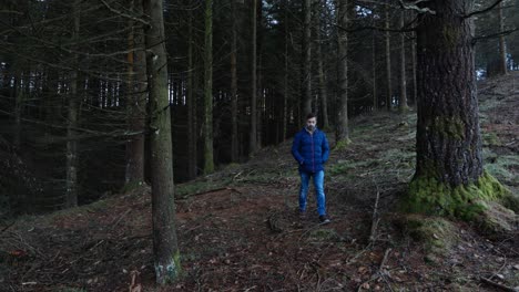 Man-walking-through-the-forest