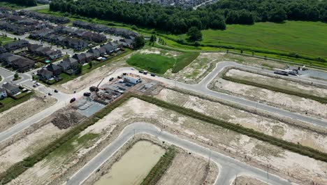 aerial construction of standalone homes foundations in new subdivision