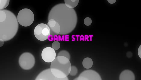 glowing circles and animation creating game start text on dark background