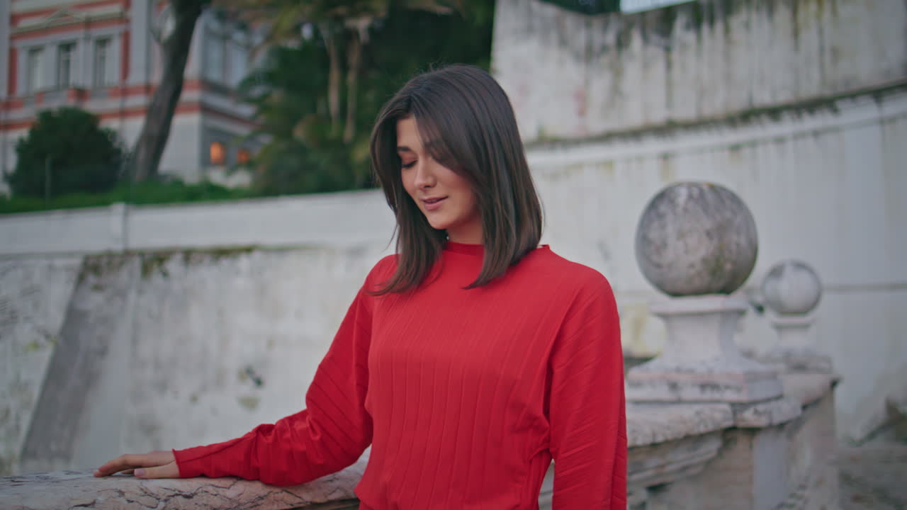 Dreamy model walking city closeup. Young woman looking camera strolling portrait