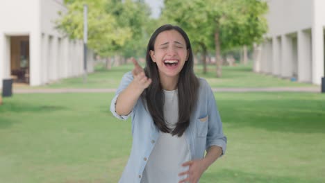 happy indian girl laughing on someone