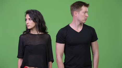 young couple looking away from each other