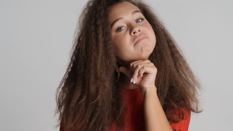 Angry-Caucasian-curly-haired-woman-threatening-in-front-of-the-camera.