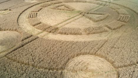 swarraton barley field strange crop circle geometric pattern artwork aerial view reverse rising shot