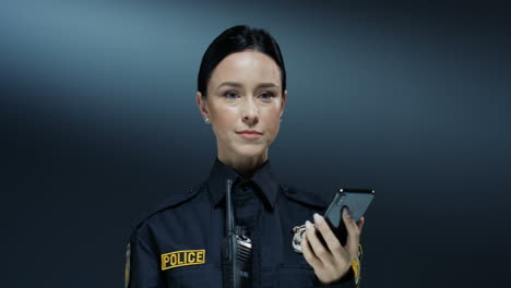 Close-Up-Of-The-Beautiful-Policewoman-Talking-On-The-Mobile-Phone-And-Deciding-Some-Important-Decisions