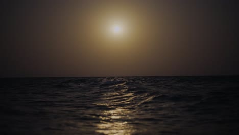 ocean-sparkles-as-waves-gently-caress-a-serene-beach-nighttime-landscape-along-the-Persian-Gulf-is-magical-tropical-paradise-perfect-for-tranquil-exploration-and-starlit-reflections-in-iran-night-sky