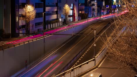 a night timelapse of the traffic jam at the city street in tokyo