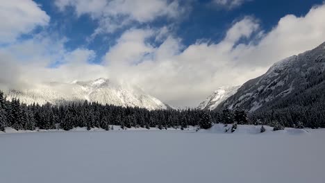 Snowcovered-Gold-Creek-Pond-Surrounded-By-Green-Woodland-In-Snoqualmie-Pass-And-The-Cascade-Range