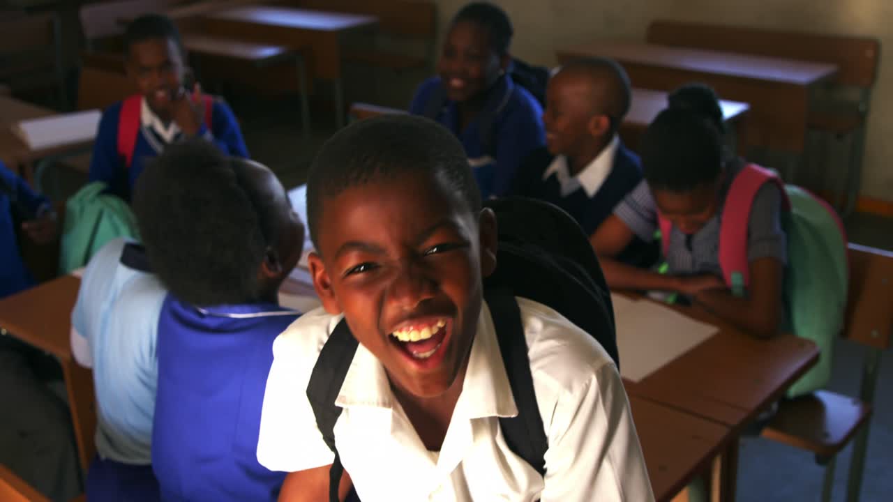 Portrait of a young schoolboy smiling 4k