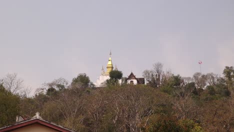 golden pagodas on phousi hill in luang prabang, laos traveling southeast asia