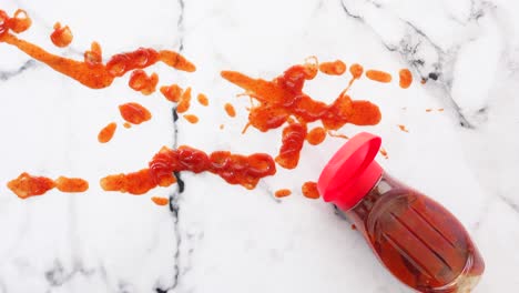 spilled red sauce on marble surface
