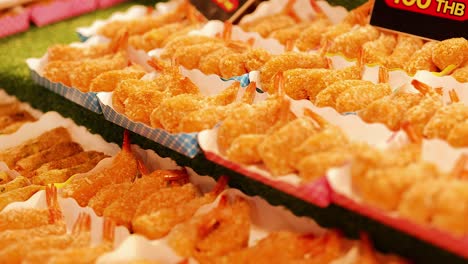 assorted deep fried snacks displayed at phuket street food market