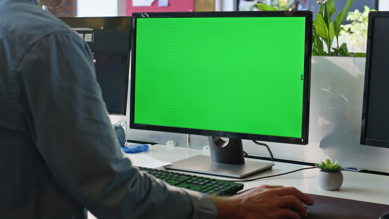 Office guy using chromakey computer closeup. Worker hand holding mouse device